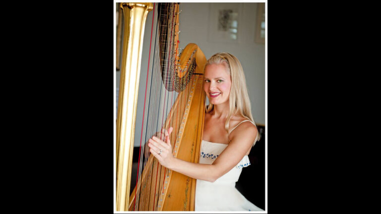 Hong Kong Harpist performing in a white dress at a corporate cocktail party
