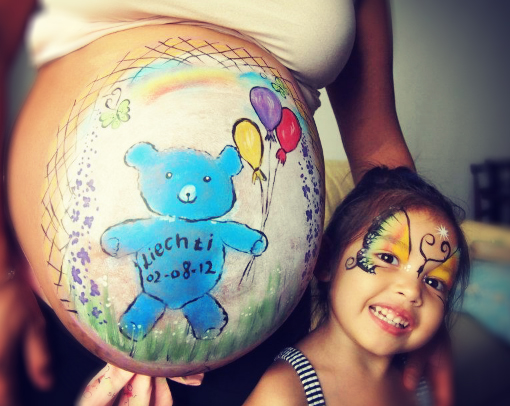 Pregnant belly face painting
