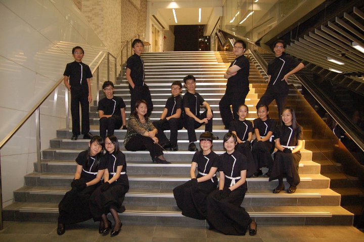 The Bells and Chimes player and the conductor taking picture on the stairs