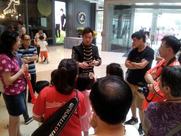 Hong Kong Walk around magician performing card trick to the audience at Popcorn Mall store opening event