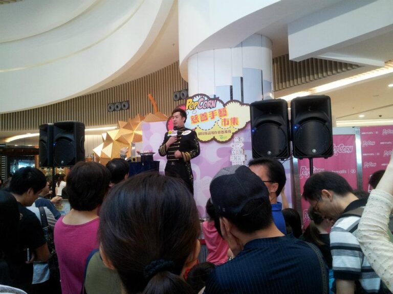 Magician performing stage magic with a mic at Hong Kong Shopping mall