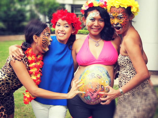 Three clients are very happy with the Hong Kong face painters work at a function