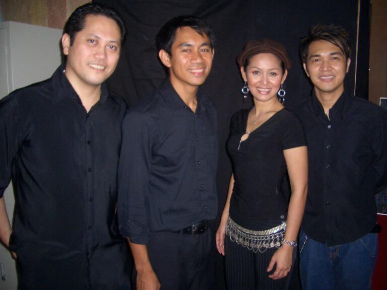 live band musician in HK taking picture with the singer before the annual dinner