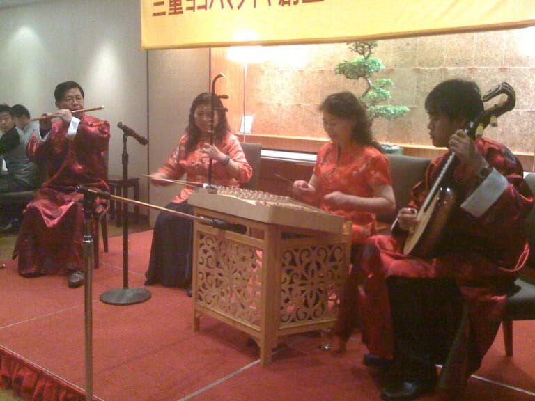 Four Chinese musicians performing at a dinner event
