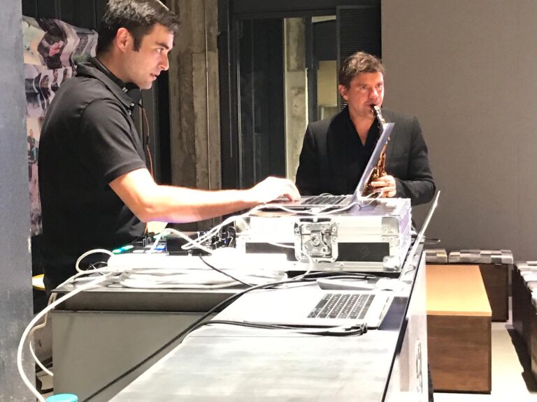 DJ With sax player at an event in hk wearing black top