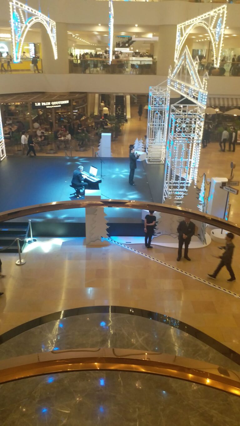 performance stage during christmas time with piano player and opera singer