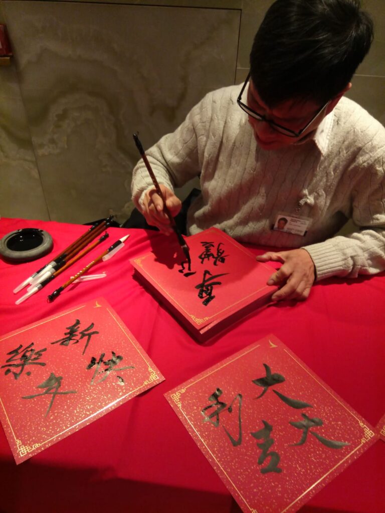 hong kong airport, cathay pacific artist working on fai chun
