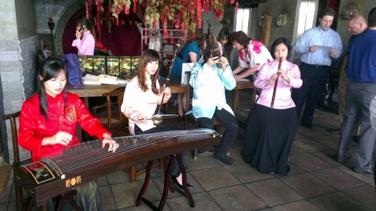 Four Chinese musicians in Hong Kong performing at a corporate Chinese theme event during Chinese new year