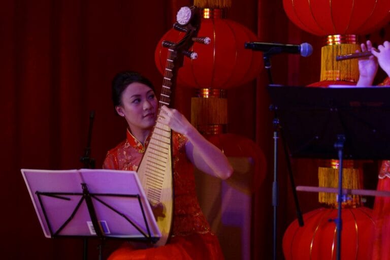 A Musician playing Chinese tradition instrument, Pipa , at a Hong Kong Bank Annual dinner event