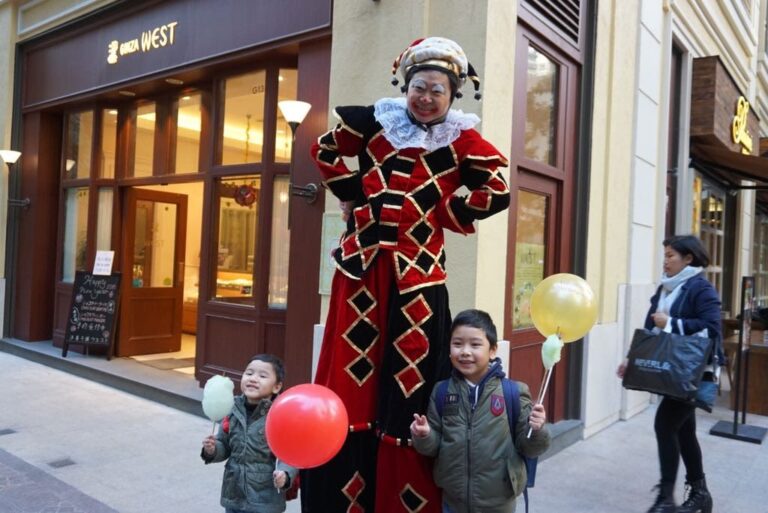 Stilt costume performer in the streets of hong kong performinhg