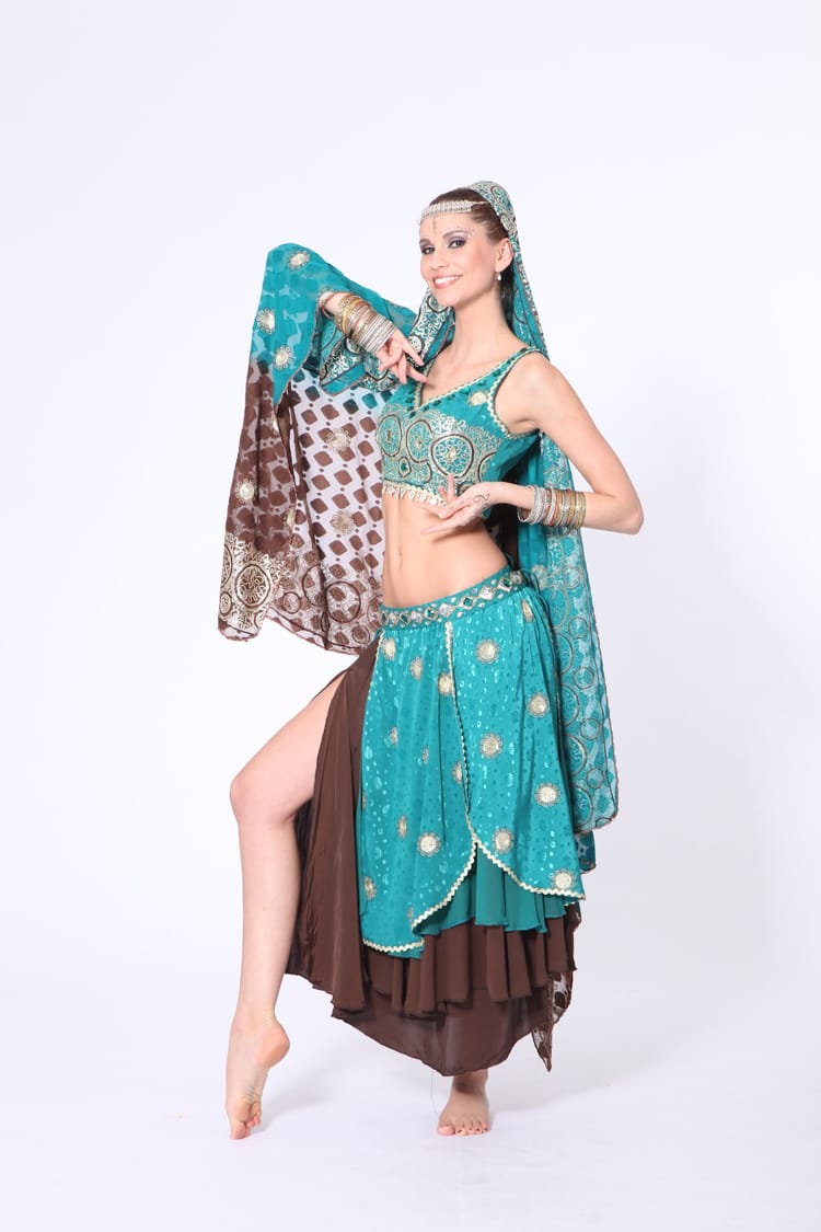 Bollywood dancer wearing teal costume with gold embroidery