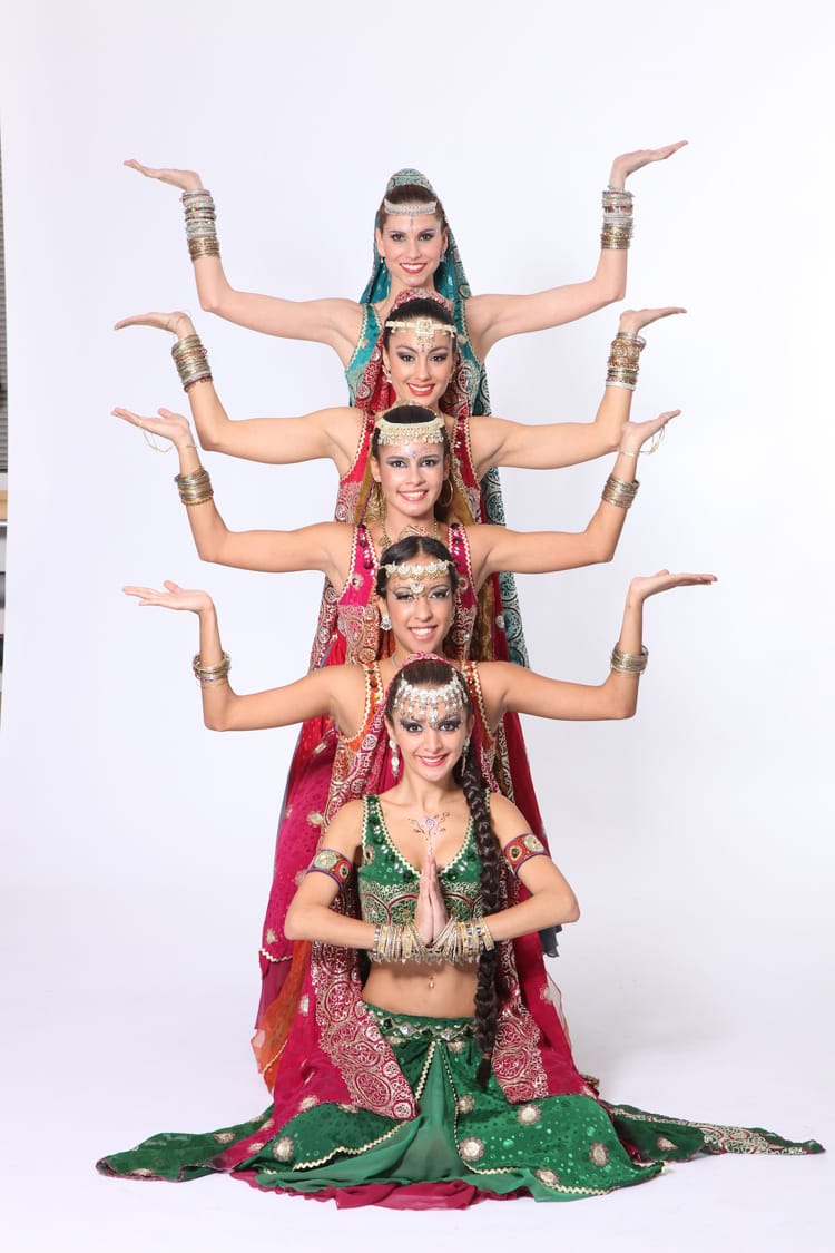 Six Bollywood dancer in HK wearing traditional Bollywood Dance costumes, posing as a line for a promote photo for a annual dinner