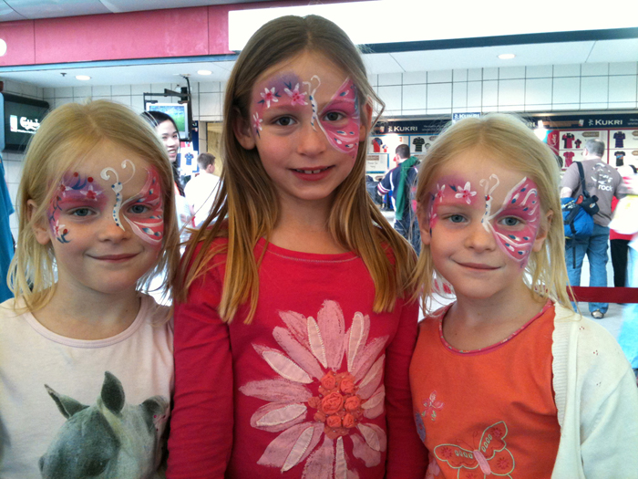 Three girls from a corporate event got a matching face paint from a face painter in HK