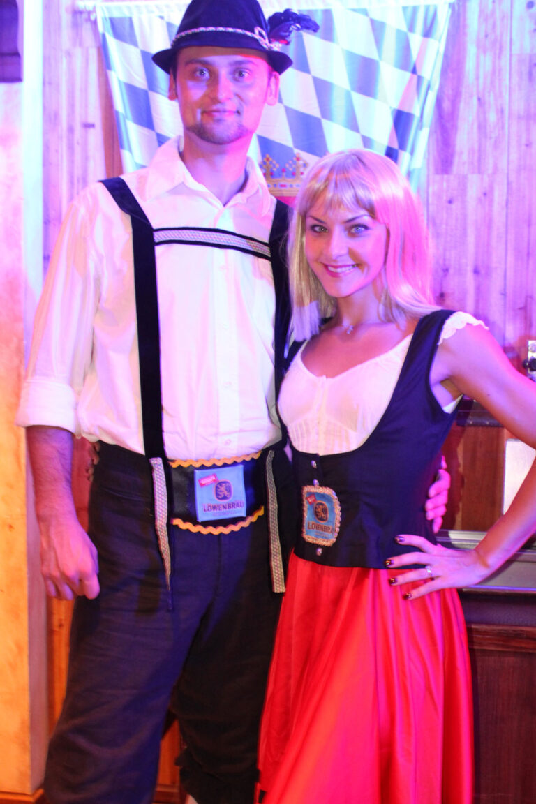 Bavarian dance duo poses at Jockey Club Oktoberfest event in Hong Kong