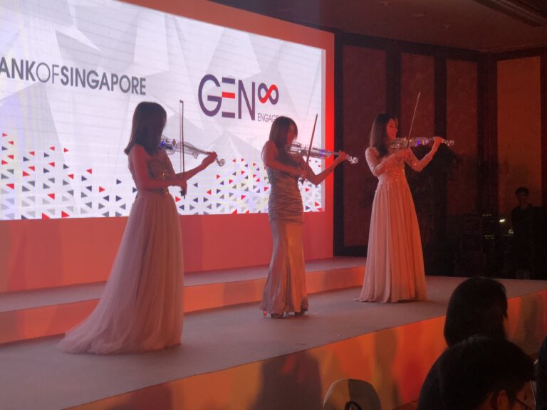 3 violinist using LED violins performance on stage