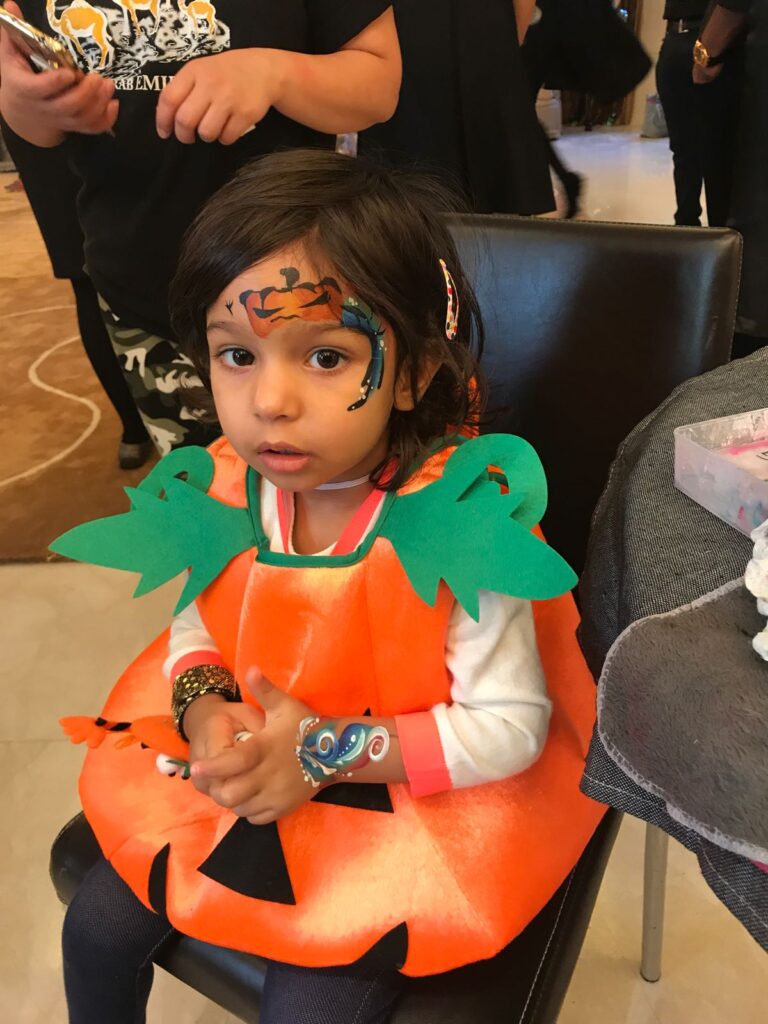 Pumpkin face painting and hand painting