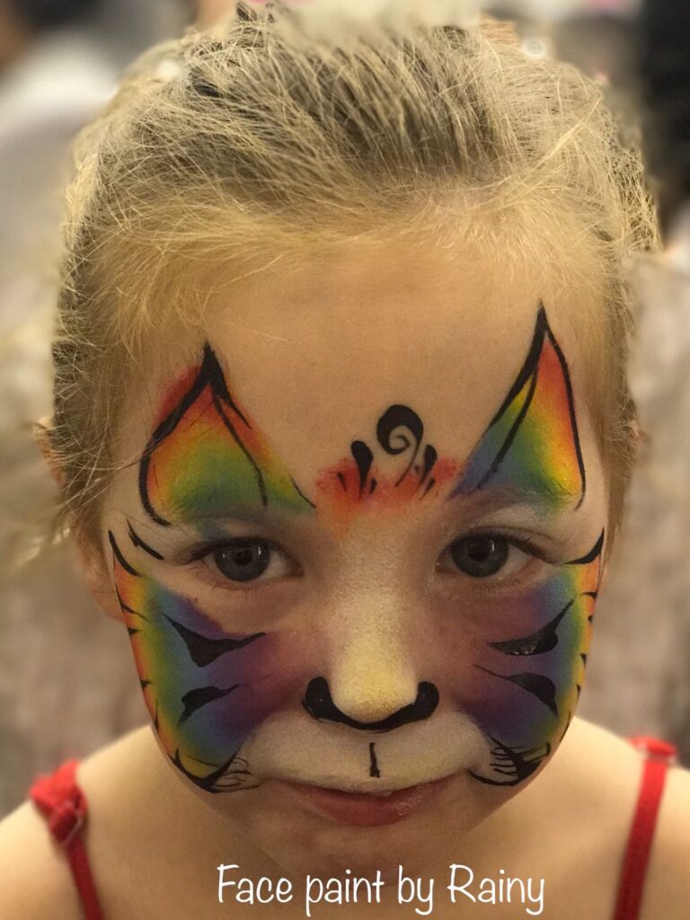 young child with tiger facepaint