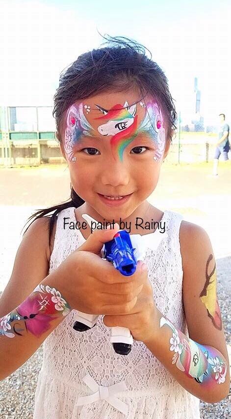 Girl with multiple face paints
