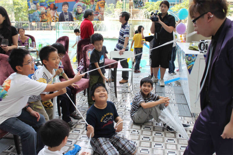 Joker and kids when he does his magic tricks