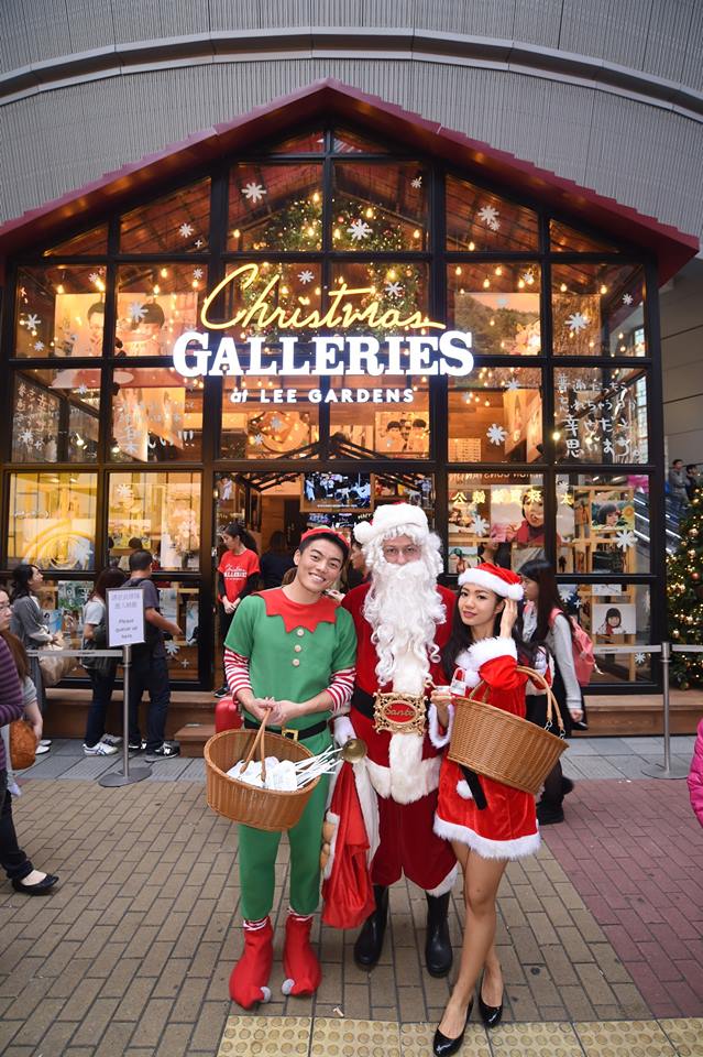 Santa performer with assistants