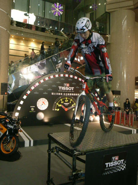 Sean doing bike tricks in Hong Kong Times Square