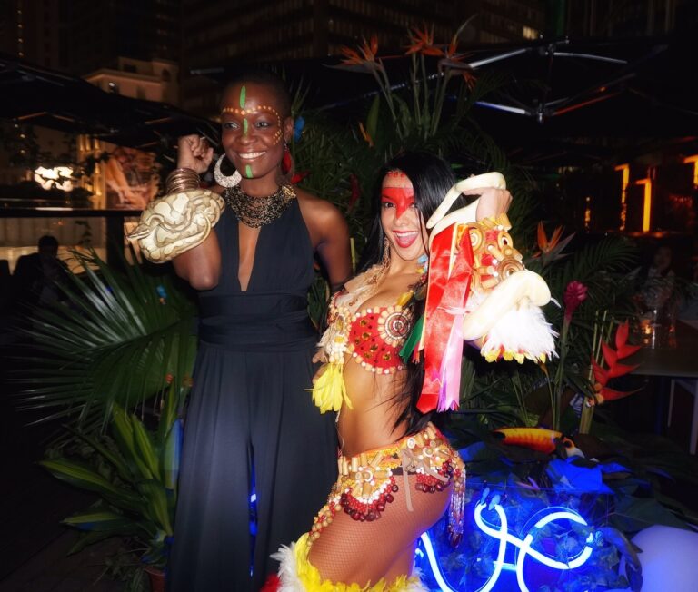Hong Kong female snake charmer photographs with her snakes