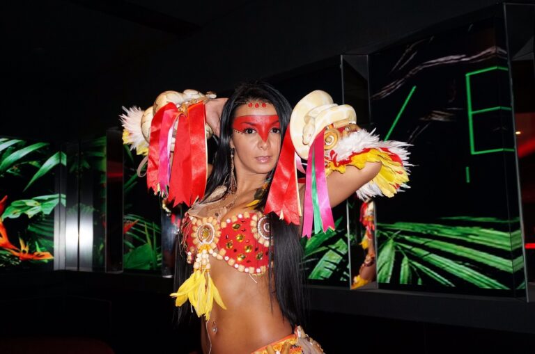 Model with 2 snakes wrapped around her at a corporate function