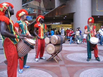 African drummer in colorful costumes in Causeway Bay HK