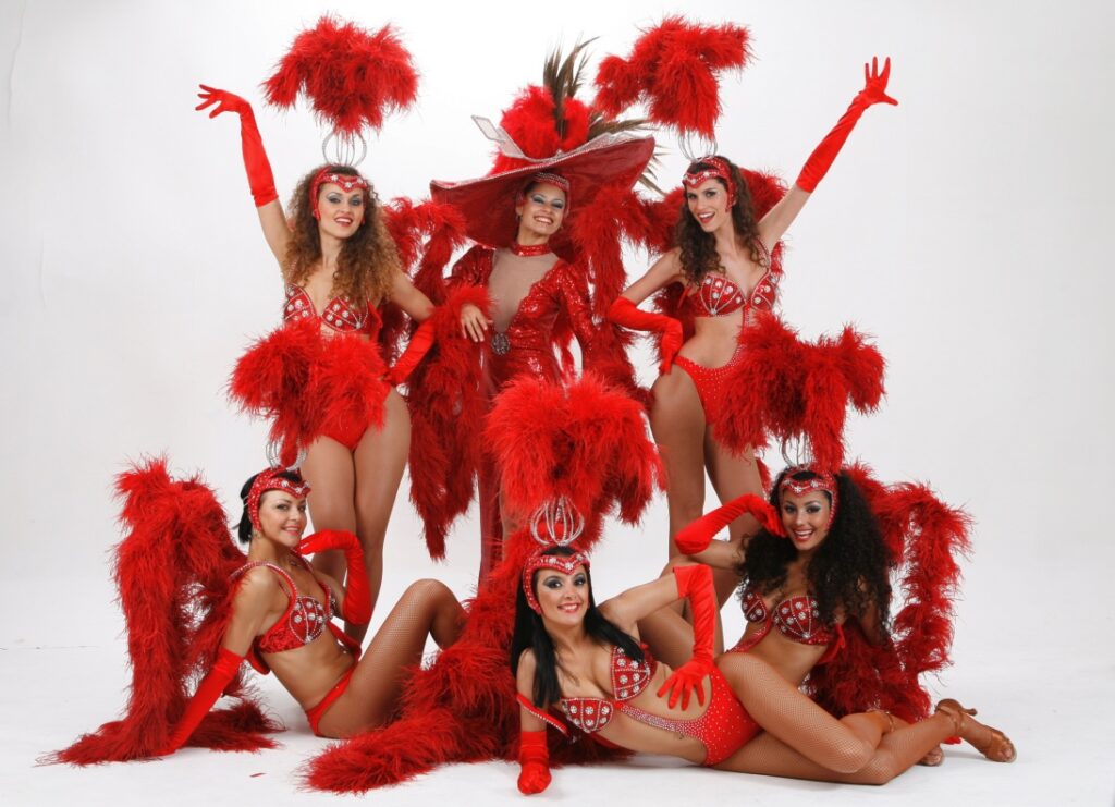 6 vegas dancers pose for camera studio shot