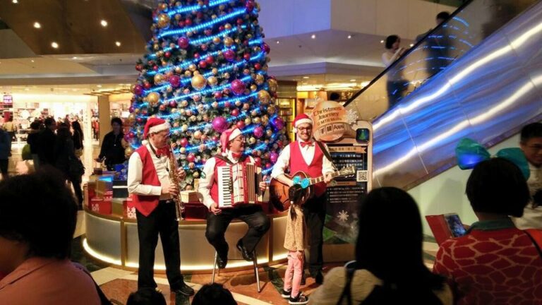 Accordion sax and guitar player during Xmas performing