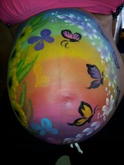 A face painter in HK draw a wonderful paint for a pregnant lady at a baby shower