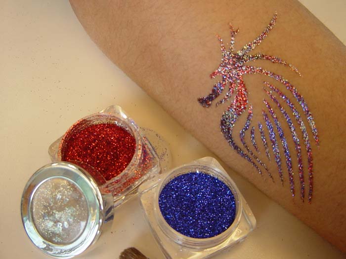 A red and blue glittering tattoo done by a tattoo artist in HK at a Xmas kids event.