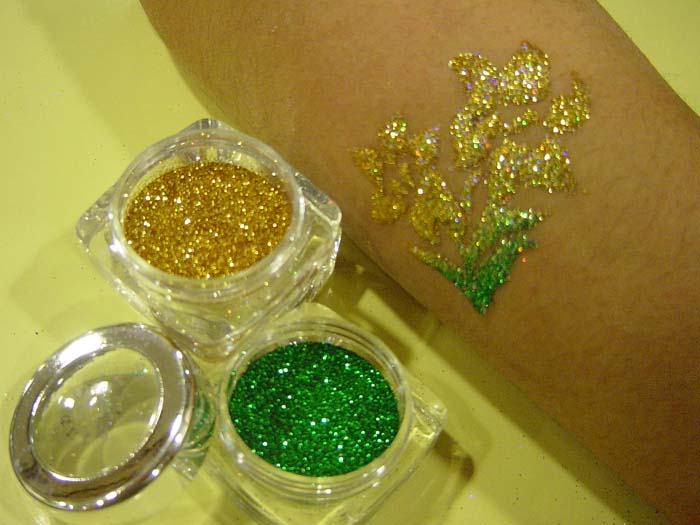A yellow and green flower glittering tattoo by HK professional tattoo artist at kids function .