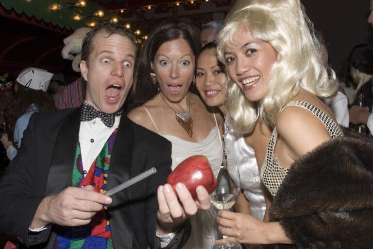 Magician producing an apple