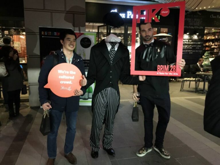 Headless man living state performing next to a cafe in a Hong Kong shopping mall