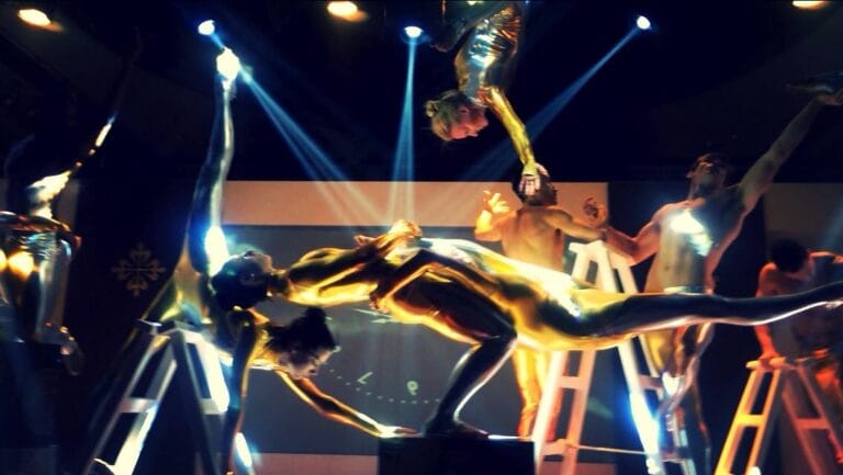 Eight Acrobat performers performing at a corporate event