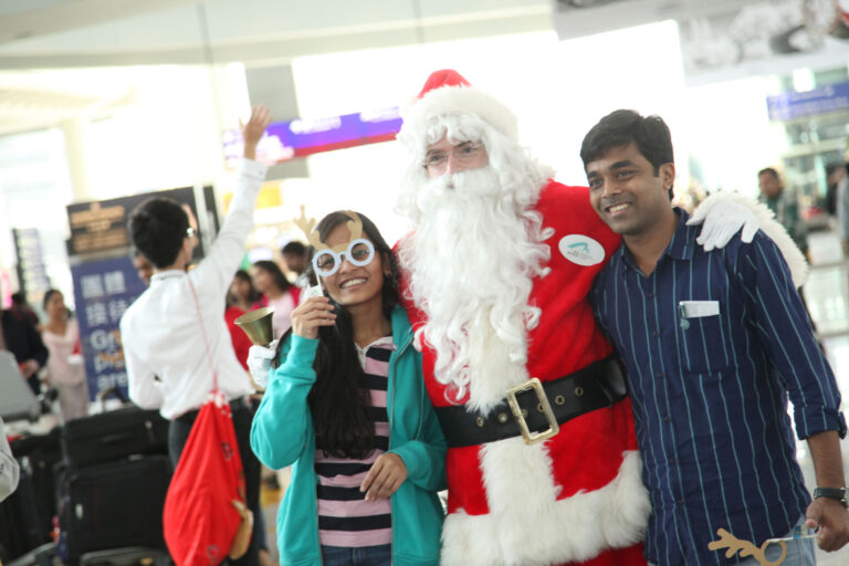 Santa posing with patrons at Hong Kong airport