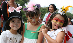 Three girl at corporate funfair in HK got a lovely face paint form a face painter.