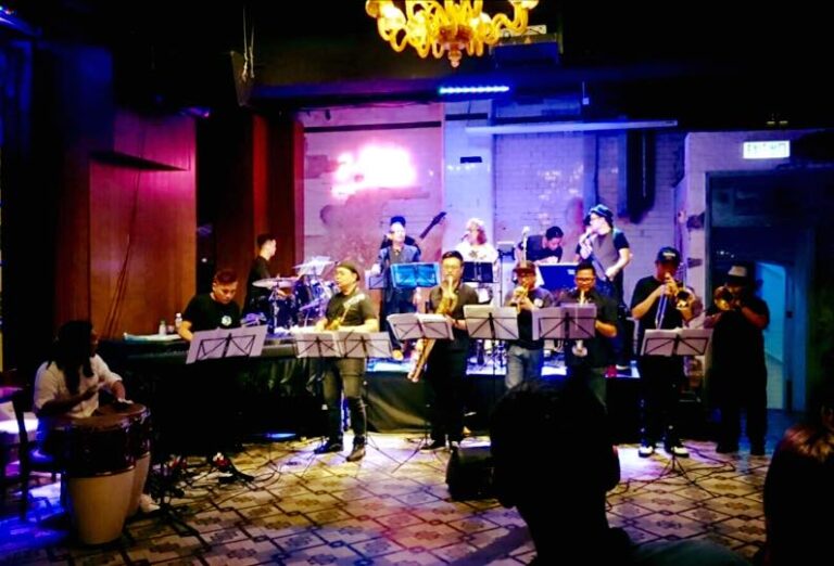 Eleven Hong Kong musicians performing at a corporate cocktails party