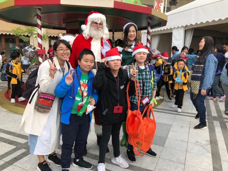 santa in hong kong with kids from an event, kids are in their casual clothing, charity event