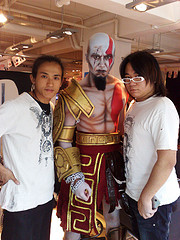 Hong Kong face painter taking picture with his fabulous work at a corporate event.