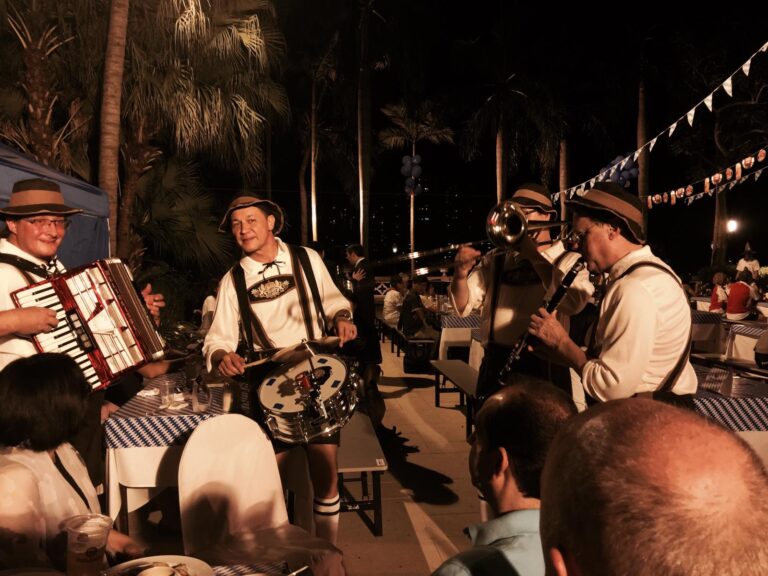 German walk around band in full costume walking around SOHO east Hong Kong, Sai Wan Ho area