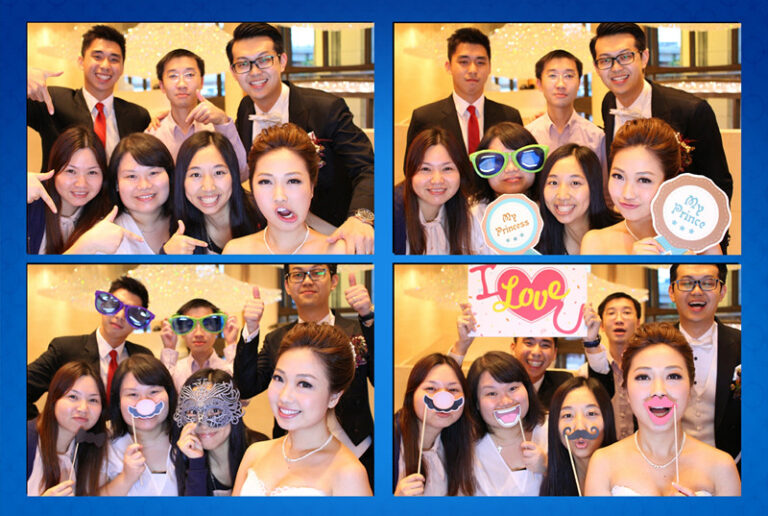 male and female guests taking photos with photobooth team props