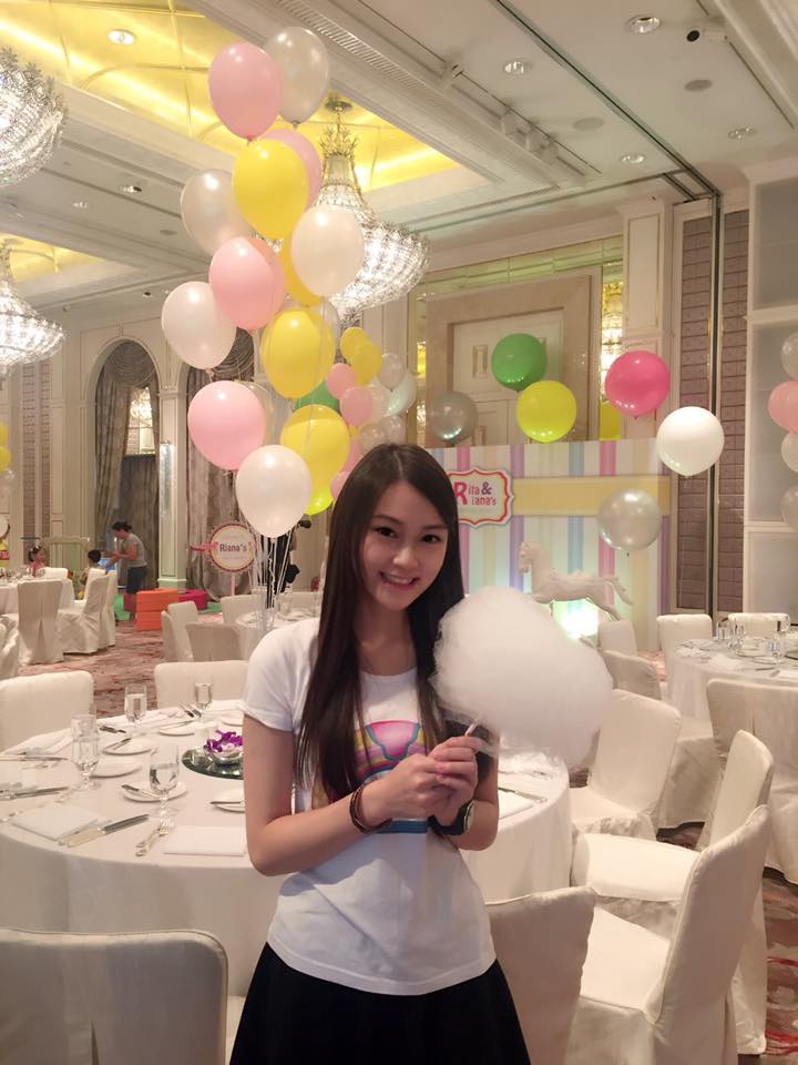 Model server in front of table set at ballroom for a birthday event