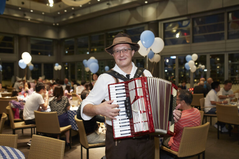 Musician performing Accordion at Hong Kong Happy Valley Jockey Clubhouse