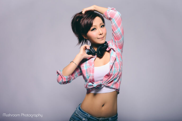 female dj z wing HK holding headphones