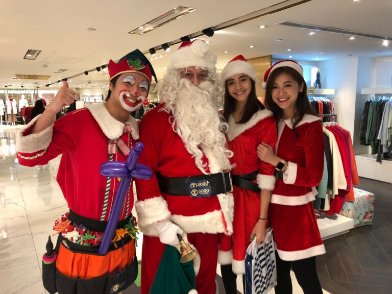sogo tst performance from performers hk with balloon elf and santa and lady santa all dressed in red