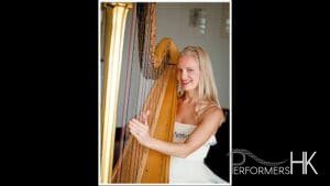Hong Kong Harpist performing in a white dress at a corporate cocktail party