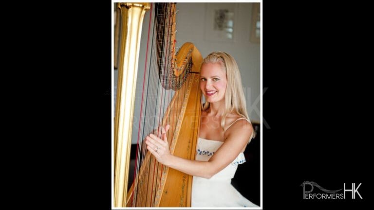 Hong Kong Harpist performing in a white dress at a corporate cocktail party