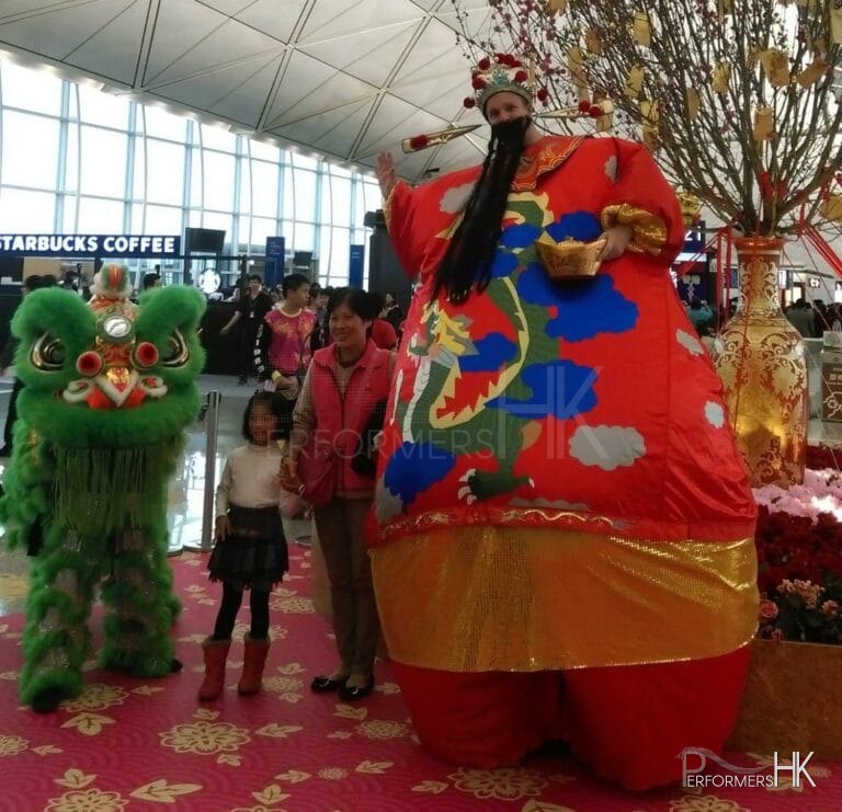 Giant inflatable Choi Sun stilt costume at the Hong Kong airport